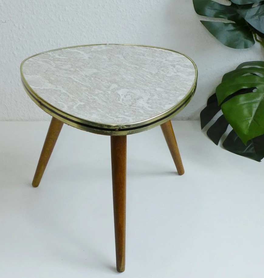 Lovely triangular plant stand - 1950s / 1960s.. Made in West Germany! The table board is made of wood with a formica surface in gray-offwhite marple optic 