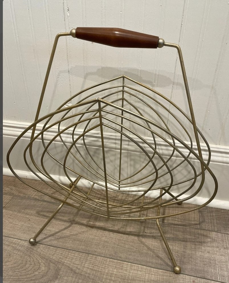 Mid Century Modern brass coloured vintage wire magazine rack from the 1960s