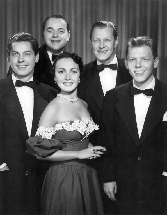 1950s photo: Publicity photo of the vocal group The Modernaires with Paula Kelly, who were regulars on the CBS Radio Club 15 radio program