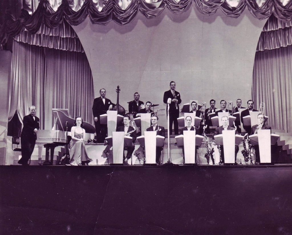 1940s Vintage photo of Canadian Veronica Foster performing with an orchestra in 1940s dress. 