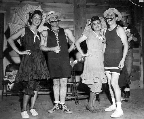 1940s vintage photo of couples dressed up in old fashion bathing suits for men and women. Fun idea! 