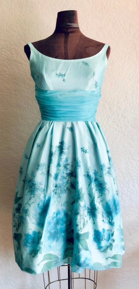 1960s Fashion: 1960s Floral Emma Domb Dress with a white floral patterned fabric with a sheer robins egg blue chiffon overlay and a wide, ruched turquoise chiffon waist band