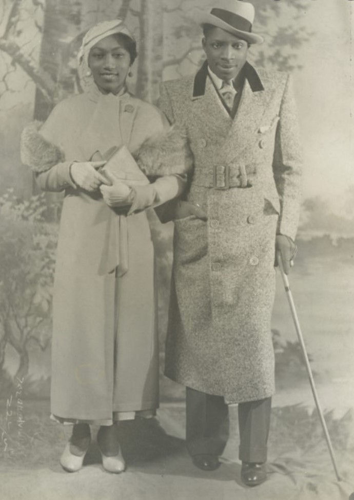 1930s vintage photo of a Black Women and a Black Man in 1930s fashions as seen in 1935. 1935 Strolling Coats. 