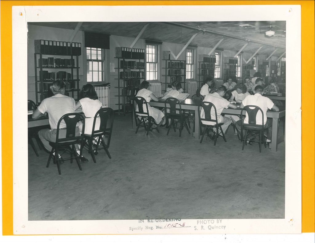 1940s vintage image of students in college studying in their library