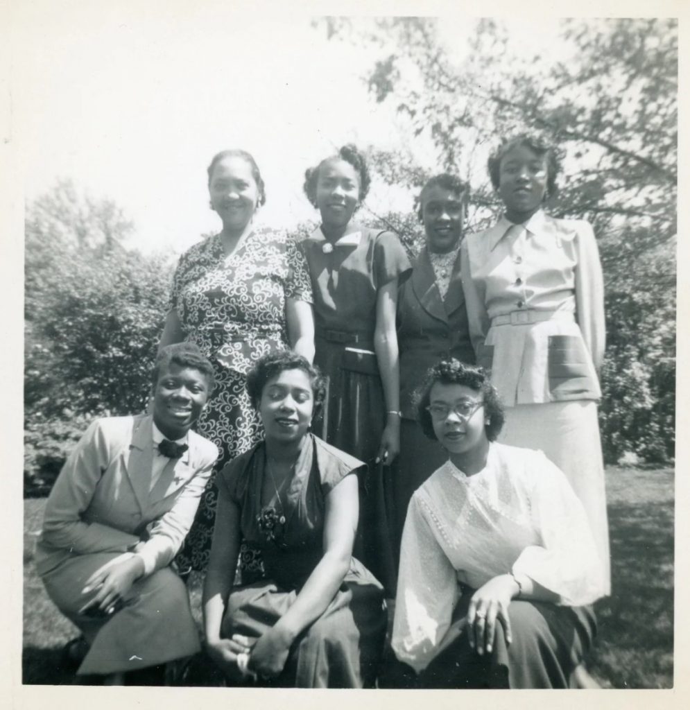 1940s vintage photo of a group of stylish Black Women in 1940s Fashions and 1940s Hairstyles. Beautiful 1940s dresses, 1940s skirt suits and 1940s blouse. 