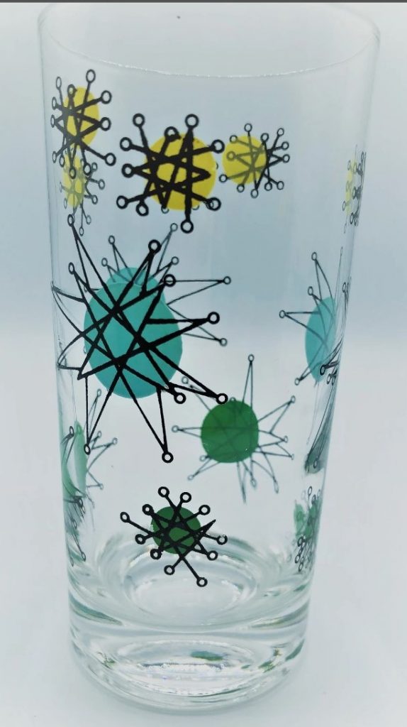 1950s vintage glassware: MCM Mid-Century Atomic Starburst Tumbler Glass circa 1950s.  Clear with Atomic Starburst design hand painted in Teal Green, Aqua, black, and yellow