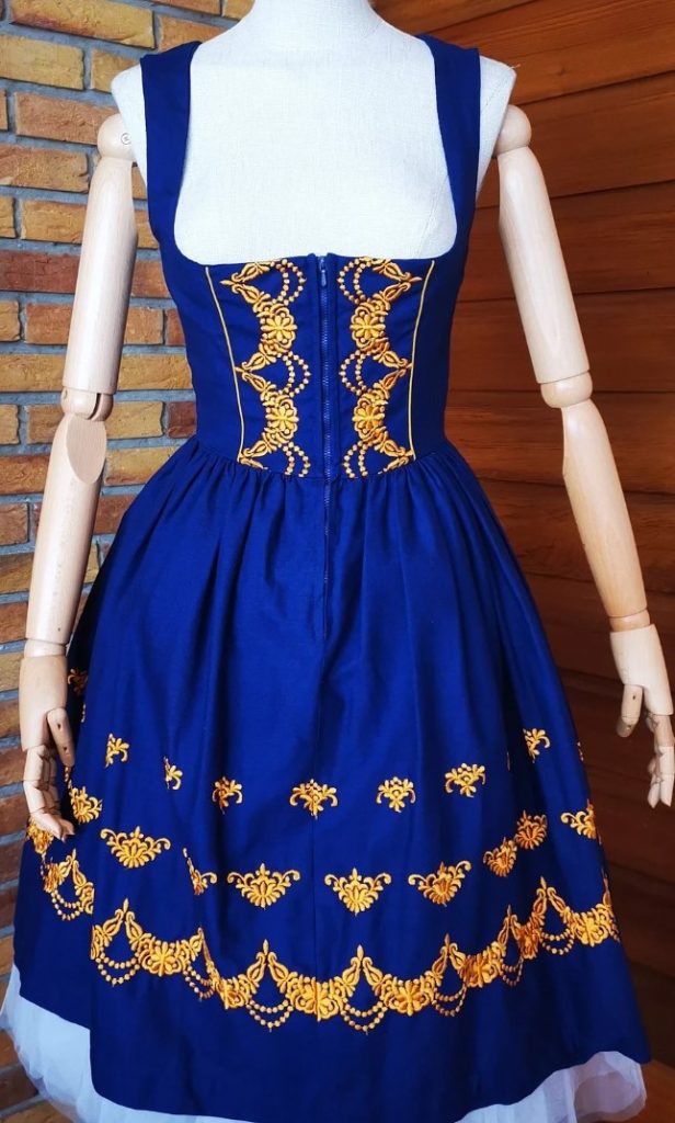 1950s Fashion / 1960s Fashion: Vintage 50/60s countrycore dark blue dirndl dress. Features: pleated skirt, bronze embroidery