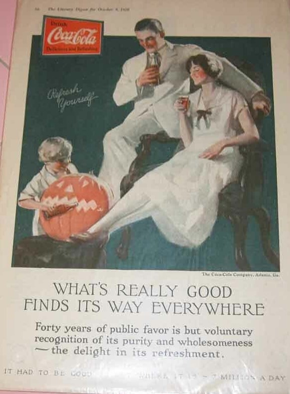 1920s ad for coca cola featuring a family enjoying a drink while the son plays with the halloween pumpkin