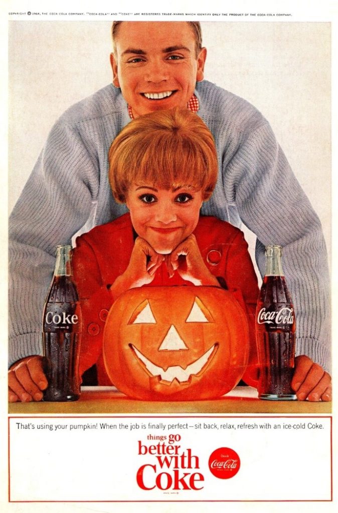 1960s Vintage Ad / 1960s Vintage Halloween Advertising: 1964 That's Using Your Pumpkin Coca Cola Advertisement featuring a Jack o Lantern and a man and woman. 