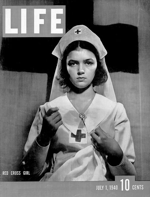 1940s vintage magazine cover of LIFE magazine from July 1st, 1940 featuring "Red Cross Girl" doing her part for the WW2 war effort. 