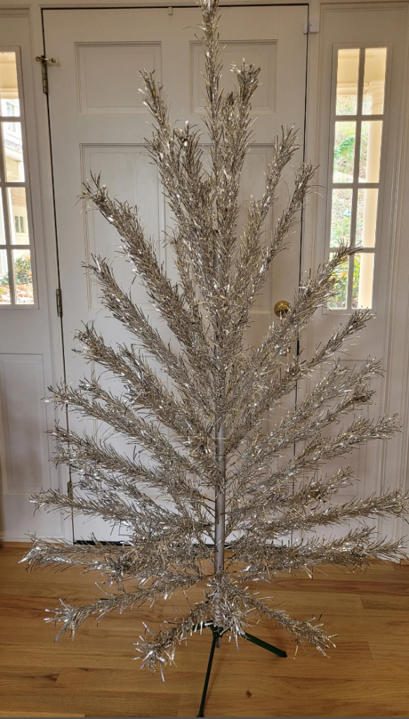 1960s / Mid Century Christmas: A Sparkler 6' Aluminum Christmas Tree complete and in original box. This tree was made by the Star Band Co. of Portsmouth, VA #S691S. The original paperwork with instructions for assembly is included and it says it was made in 1962.