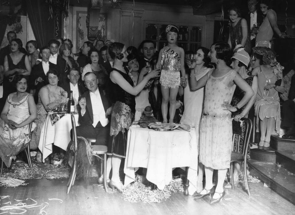 1920s Vintage Photo from a 1920s New Years Party. A doll is dubbed "Miss 1926" at a New Year's Party on Jan. 1, 1926.