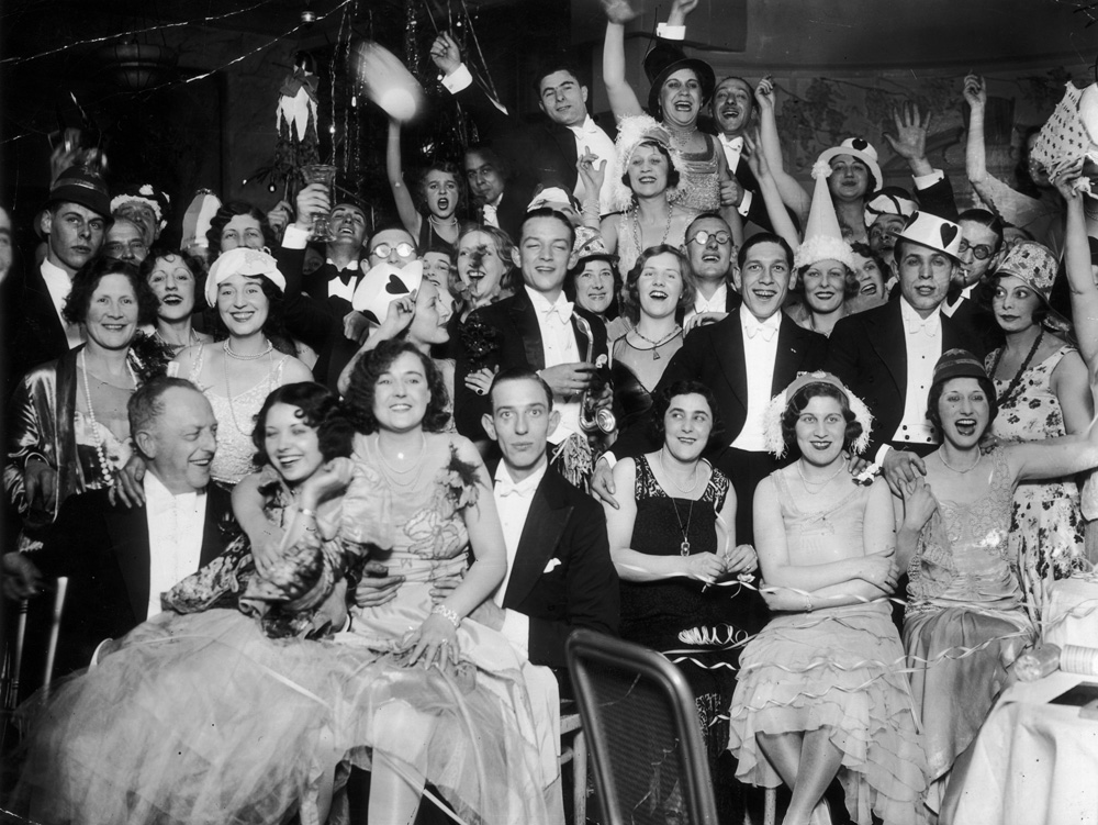 1930s vintage photo of a 1930s New Years Eve party. A New Year's Eve party at Deauville Restaurant, Regent Street in London on Jan. 1, 1930.