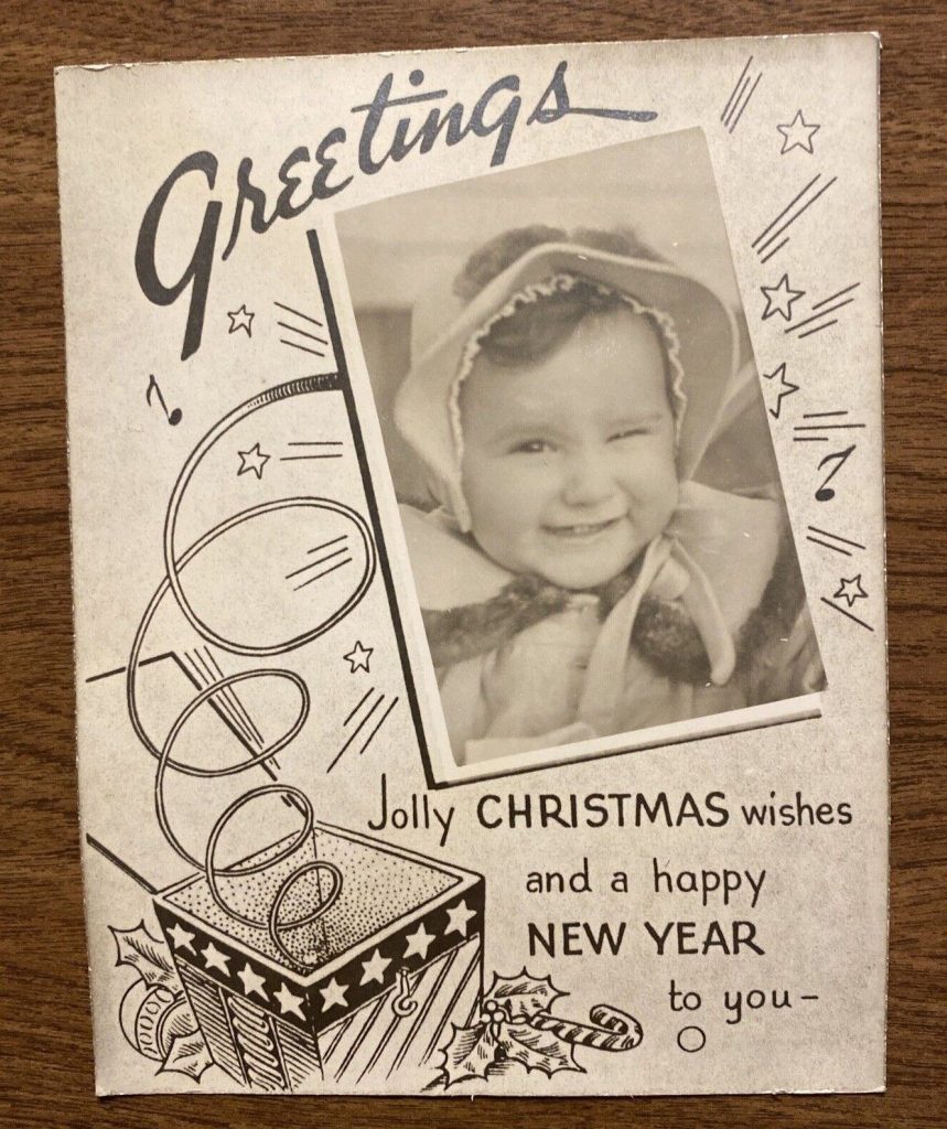 1940s / 1950s vintage Christmas Card featuring a cute image of a baby on the christmas card. 