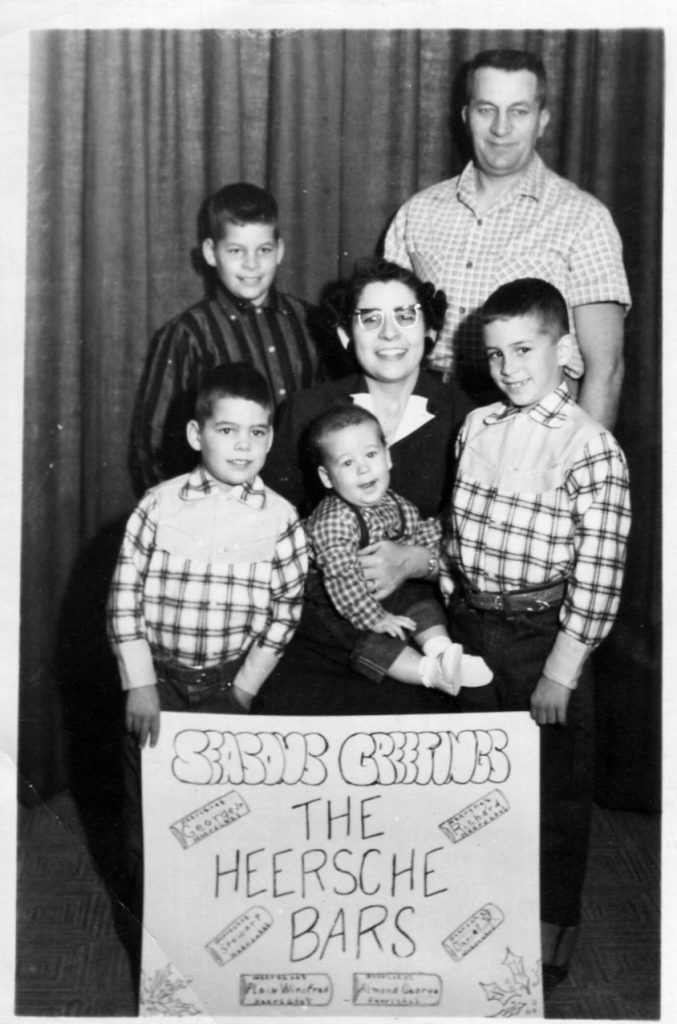 1950s vintage photo christmas card featuring a cute 1950s family with a homemade sign for this homemade christmas card. 