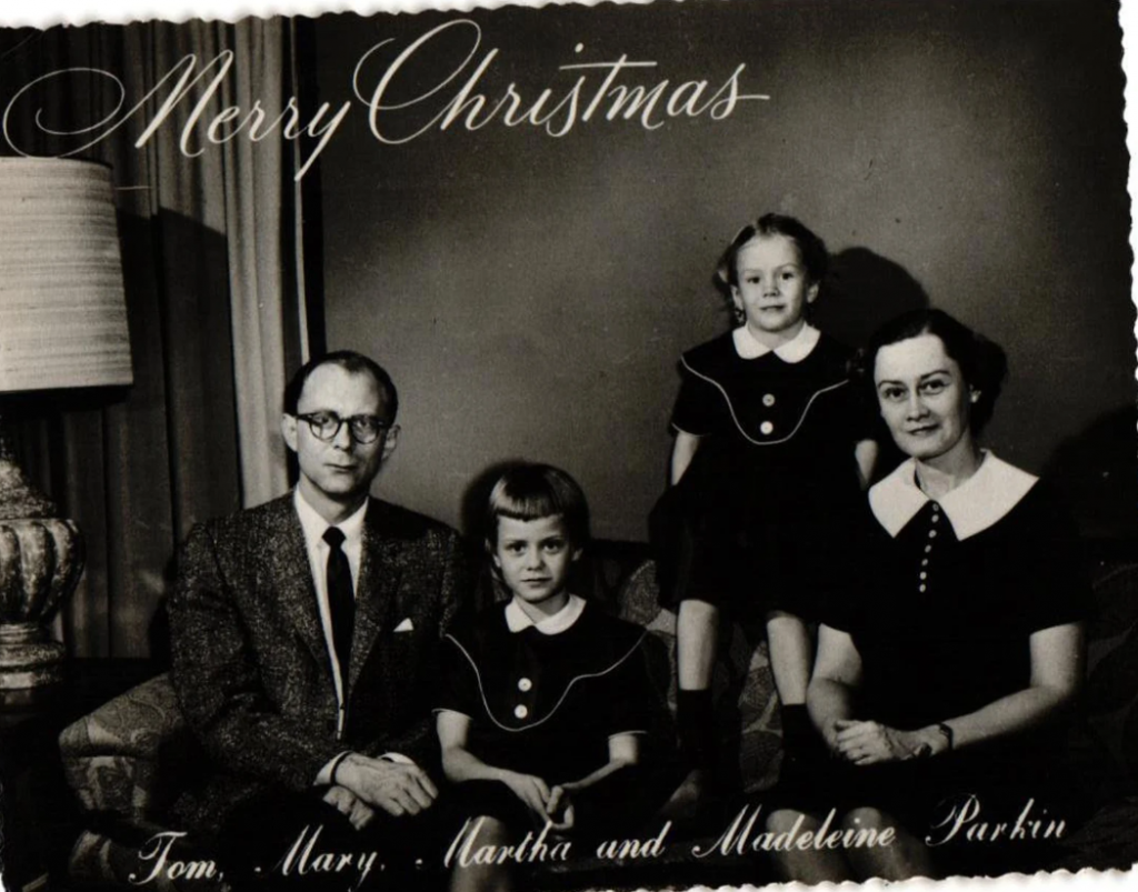 Vintage Black & White Family Photo Christmas Card From 1950s featuring a Mother Father 2 Sisters wearing similar outfits.