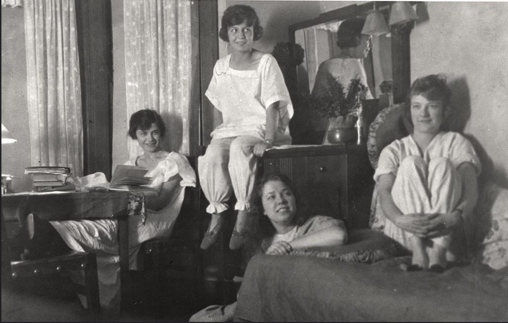 1920s vintage photo of a group of young women in their dorm room hanging out in their pajamas at the University of Wisconsin Madison