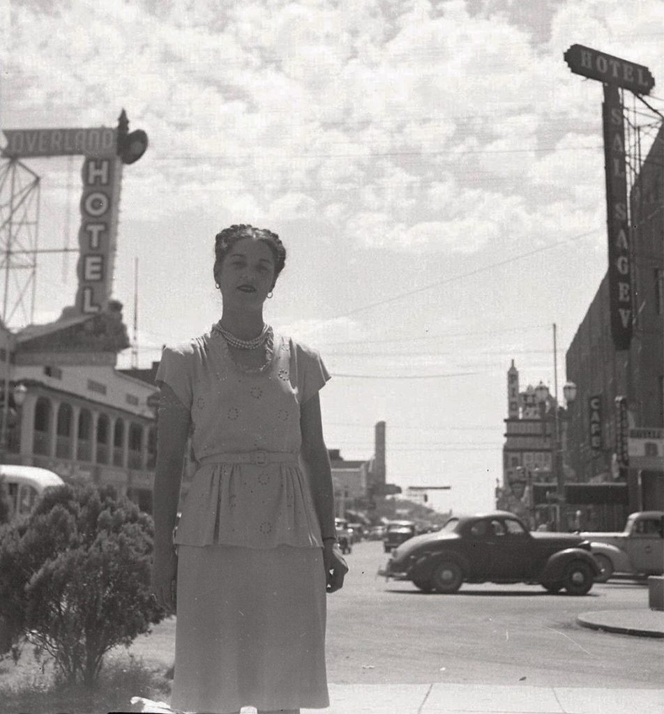 1940s vintage photo of a woman in a 1940s dress and a braided 1940s hairstyle at Fremont & Main, 1946. She's standing at Union Park which was in front of the Union Pacific depot. The photo is sometime between May-Nov. 1946.