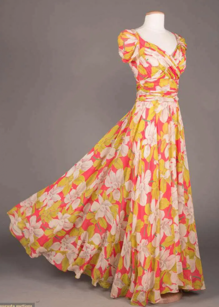 1940s Fashion: 1940s silk chiffon gown in a tropical / floral print by Ceil Chapman. 