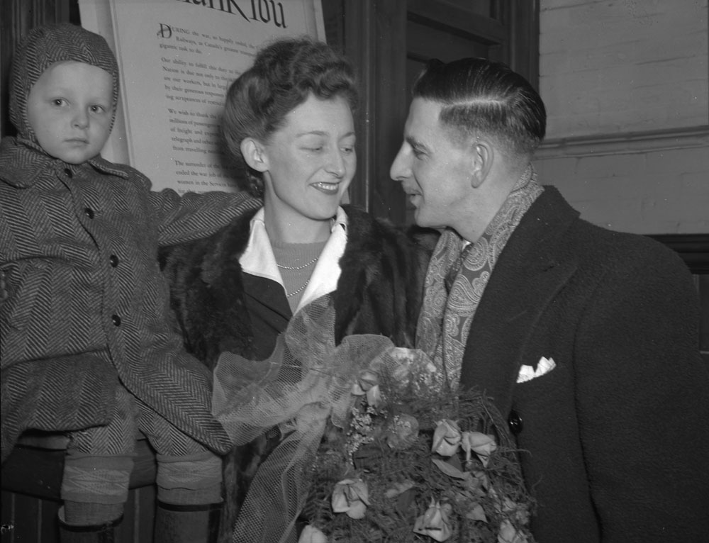 1940s Vintage Photo: A war bride and child arrive at Bonaventure Station in Montreal, Quebec, on 4 March 1946. The mother and child had travelled across the ocean on board the SS Aquitania.