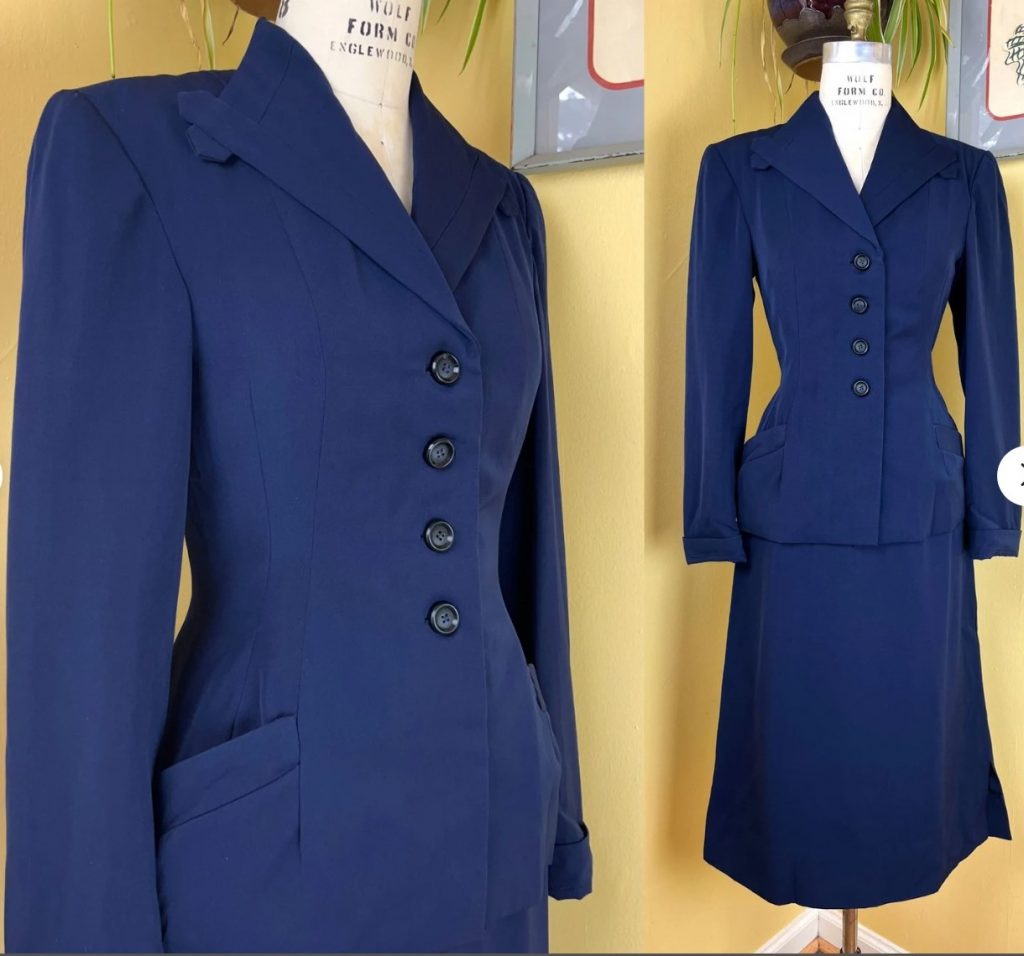 1940s Fashion: vintage 1940s suit, made of a high quality navy blue wool gabardine
➡ quintessential 40s silhouette with very .thick padded shoulders + sleek waistline + A line skirt