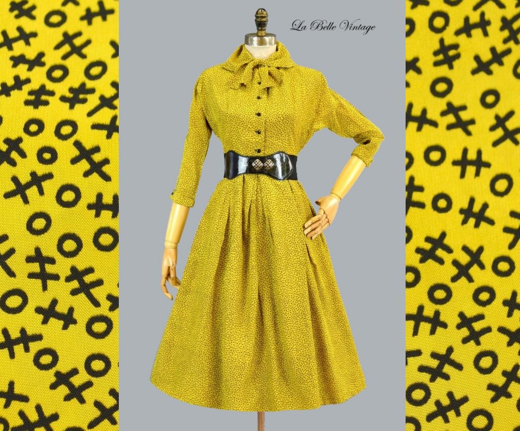 1950s Fashion: 1952 Jonathan Logan dress in yellow with a tic-tac-toe pattern on the dress. 