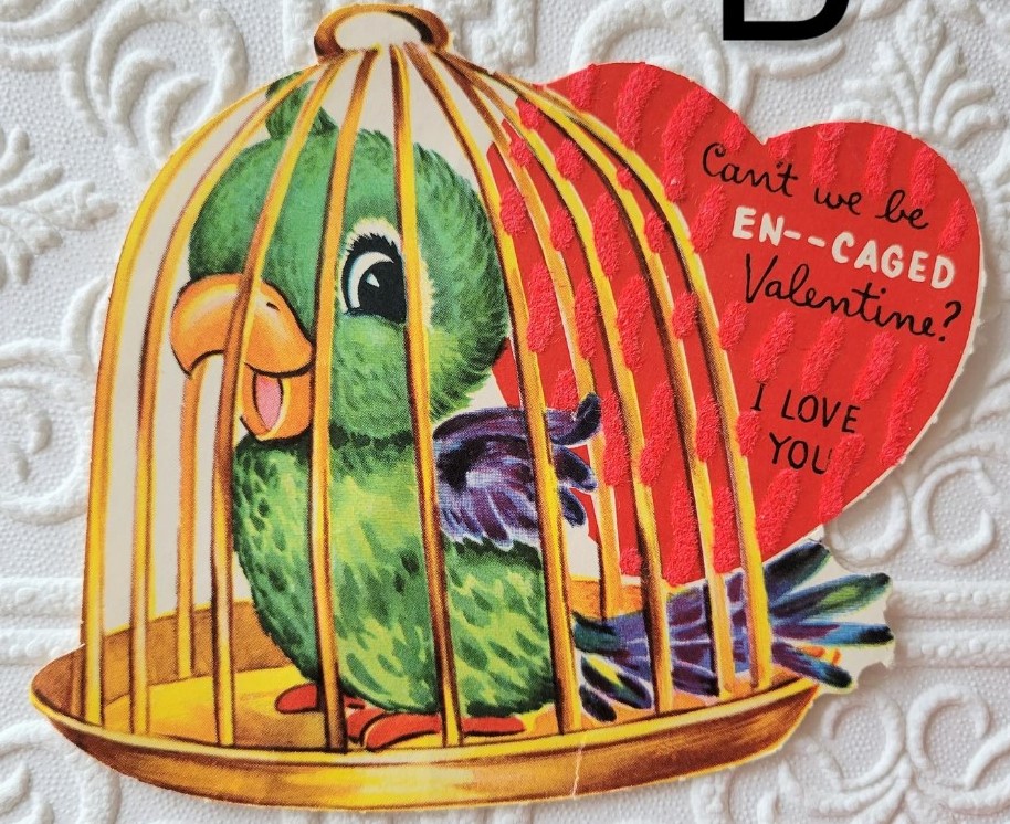 1950s Vintage Valentine's Day card featuring a cute bird in a cage. 