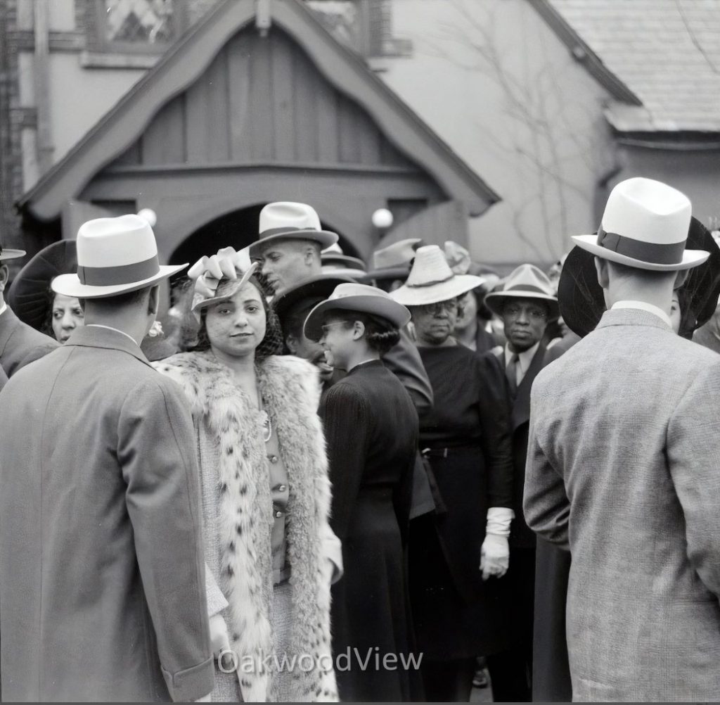 1940s vintage photo of Churchgoers on Easter Sunday in Chicago dressed in 1940s fashions. Stylish group of Black Men & Black Women