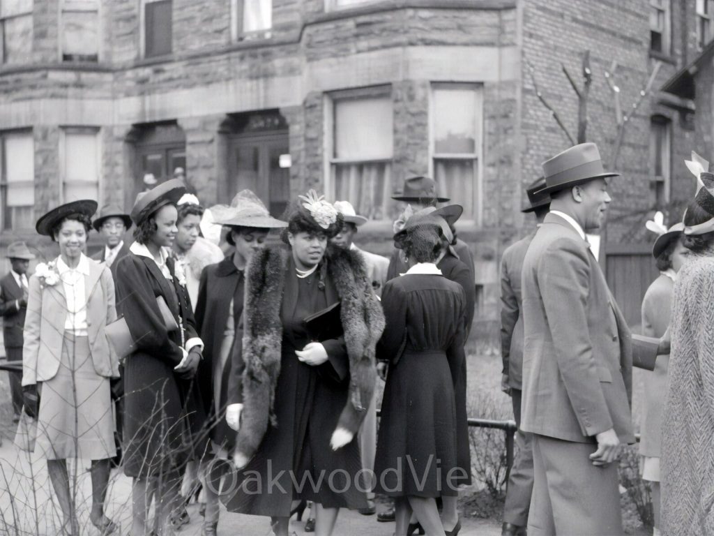 1940s vintage photo of Churchgoers on Easter Sunday in Chicago dressed in 1940s fashions. Stylish group of Black Men & Black Women