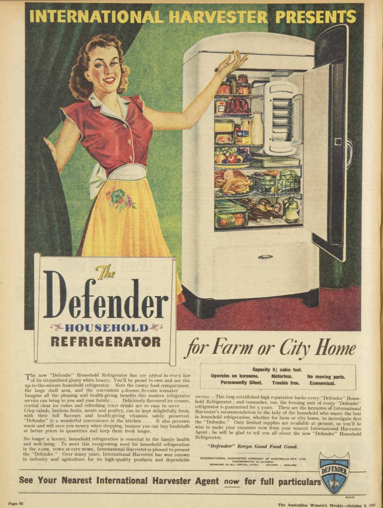 1940s Vintage Ad / Old Refrigerator Ad: 1946 advertisement for International Harvester Defender refrigerator featuring a woman in 1940's outfit & hair posing with her fridge.