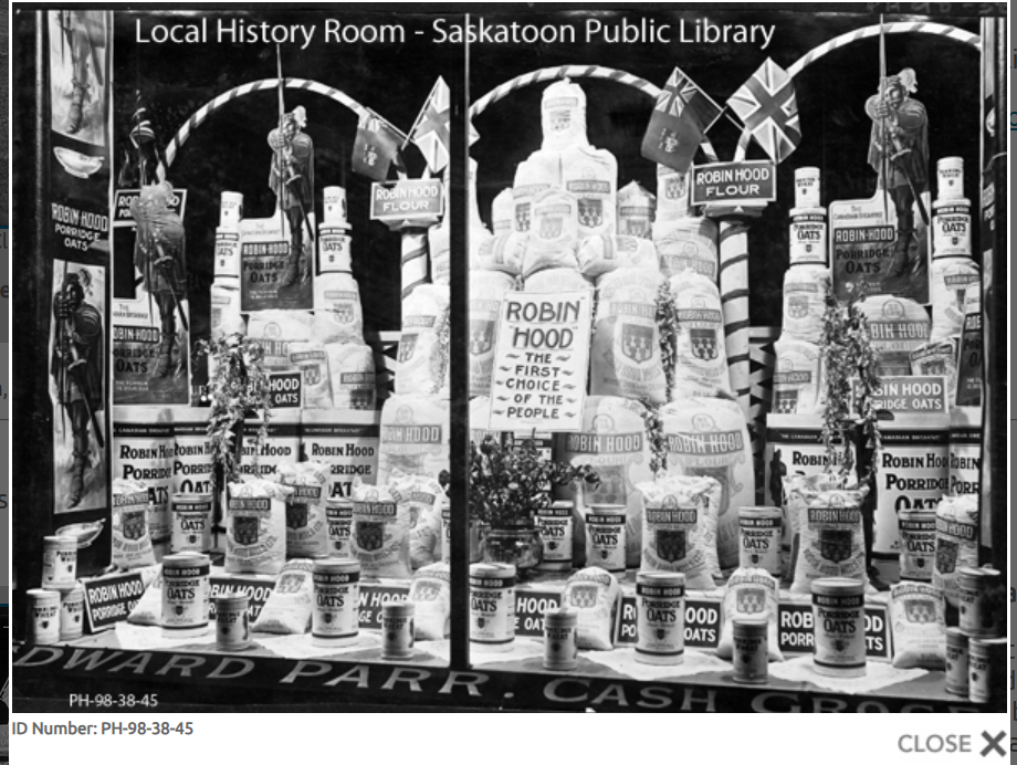 1912 Robin Hood display in the window of Edward Parr Cash Grocery (Saskatoon).

A sign in the centre boasts "Robin Hood - the first choice of the people". Bags and canisters of flour, rolled oats and porridge oats and wheat in a variety of sizes are topped by several cardboard cutout signs of Robin Hood with bow and arrows, the Union Jack and Red Ensign.