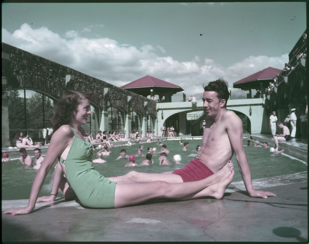 1940s vintage photo of a couple in 1940s swimsuits at the Cave and Basin swimming pool, Banff National Park, Alberta, 1948.