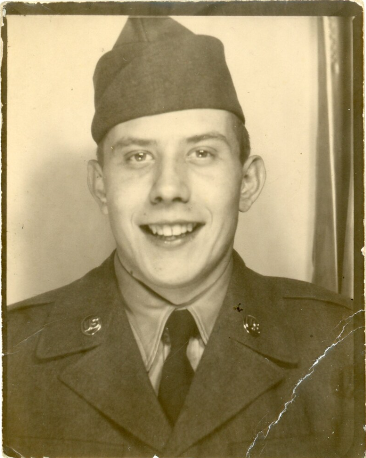 1940s vintage photo booth ~ Smiling young man in Army uniform.