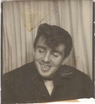 1950s vintage photo booth image of a teenager boy with a ducktail hairstyle.