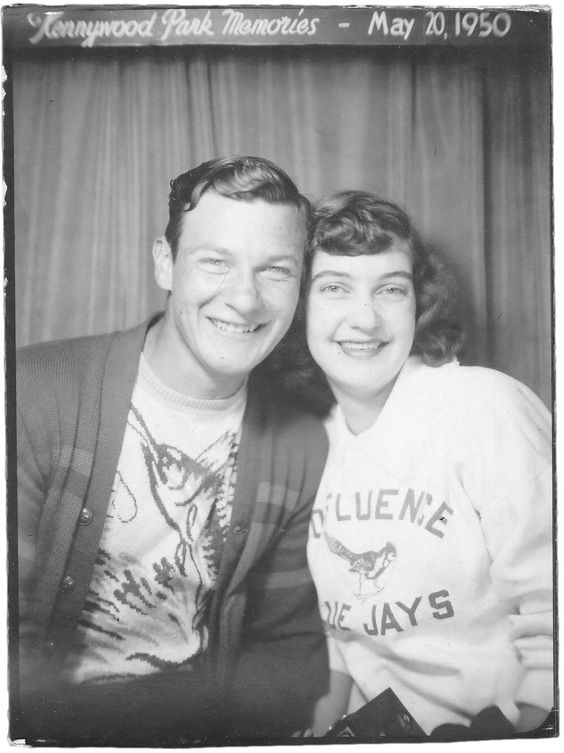 1950s vintage photo from May 20th, 1950 of a young man and young woman posing together with a fish sweater and blue jay sweater. 