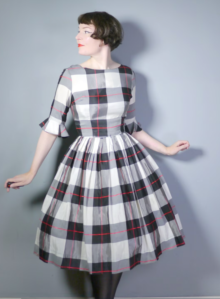 1950s / 1960s Vintage Fashions:  lovely Teena Paige Swing Dress in a wintery plaid print of white, black and red. Fitted bodice with a high collarless rounded neck and cute half sleeves with bell cuffs. Fun Vintage Fall / Winter Fashion Inspiration