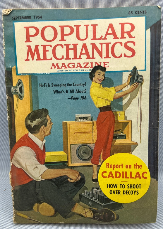 1950s vintage magazine: Popular Mechanics from September 1954 featuring an illustration of a 1950s couple putting up speakers