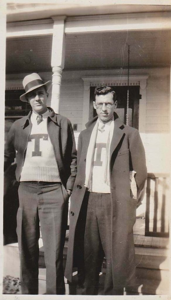 Two handsome college men posing together with their matching letterman sweaters on. Late 1930s/ early 1940s photo. Super vintage men fashion inspiration.