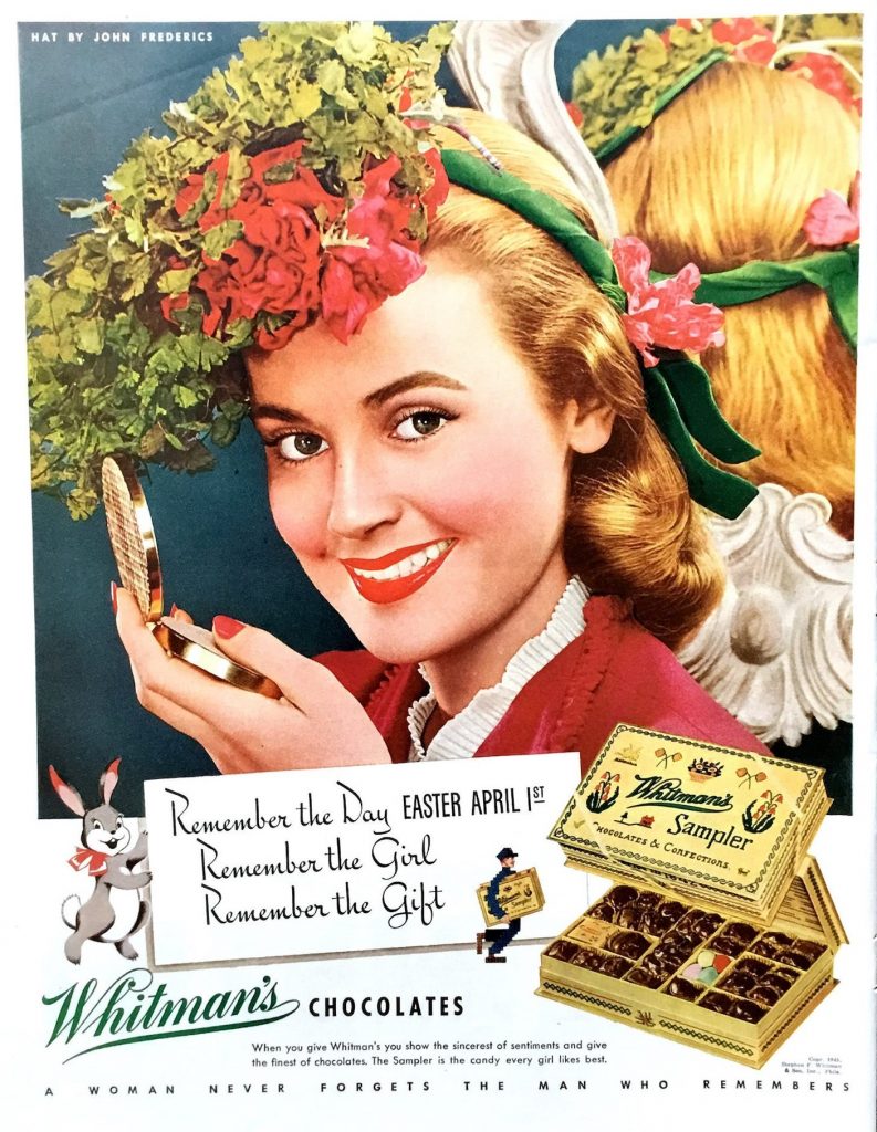 1940s vintage advertisement for Whiteman's Chocolates featuring a woman with a 1940s hairstyle and wearing an Easter bonnet made of flowers.