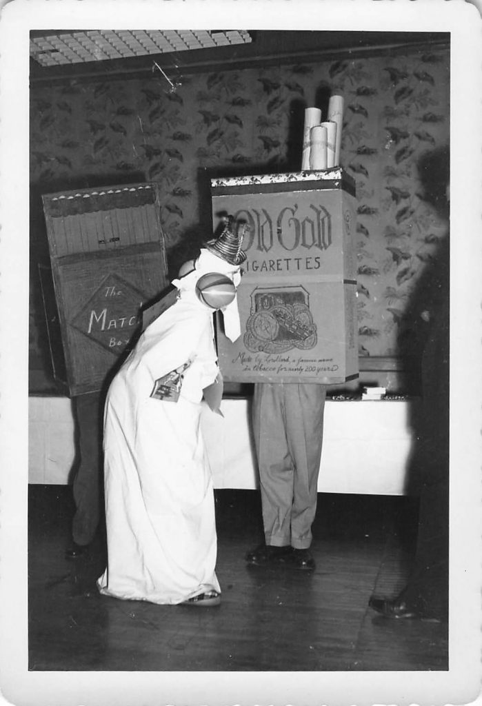 1940s vintage Halloween party photo featuring a cigarette box costume and a matchbox.