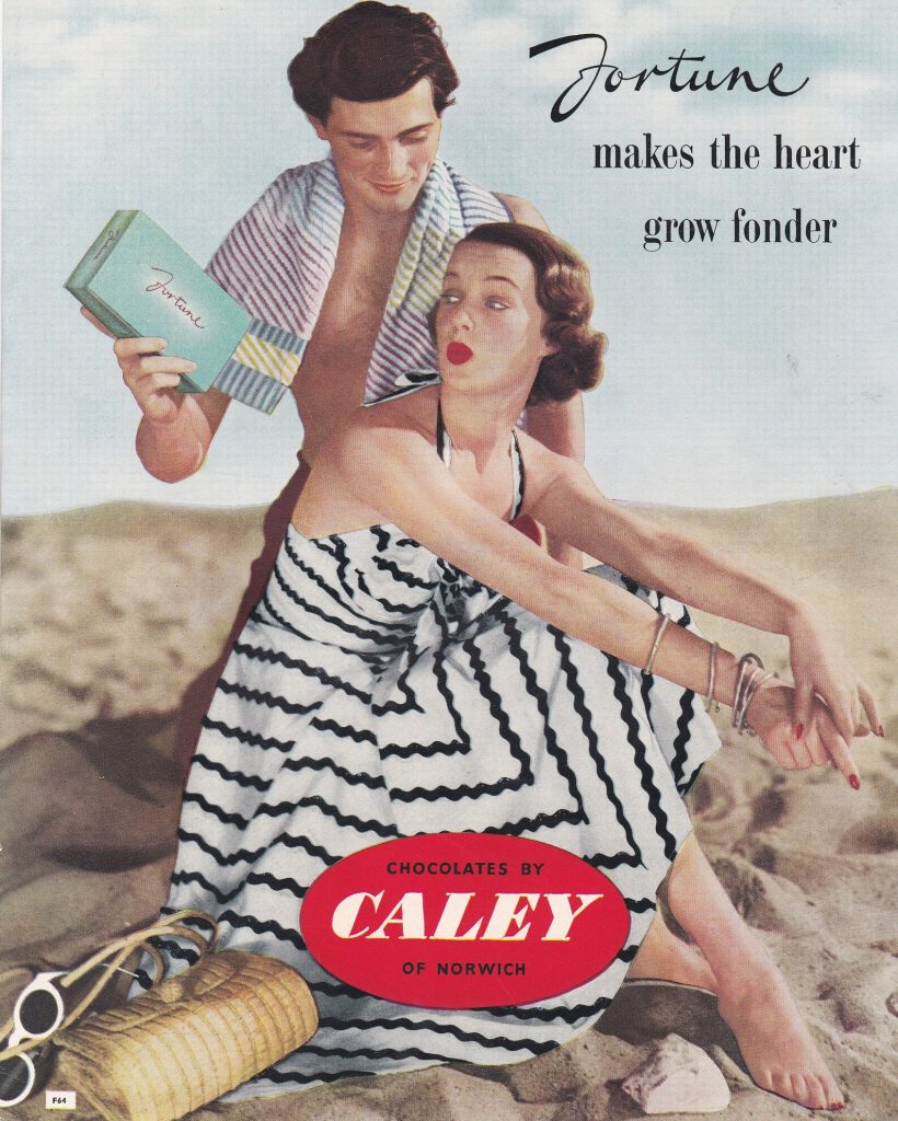 1950s vintage advertisement for Caley Chocolates featuring a man and woman on the beach the woman is wearing a 1950s sundress