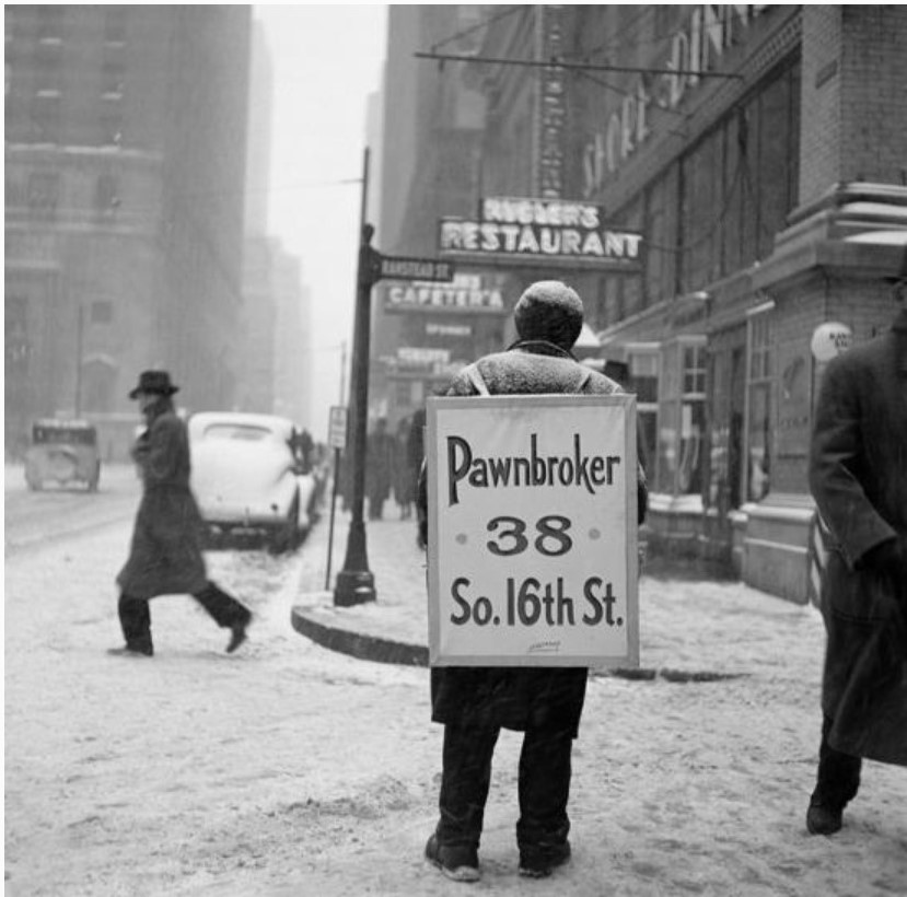 1930s vintage photo: 1930s Winter Street Scene of Man Wearing Pawnbroker Sandwich Board in New York City. 