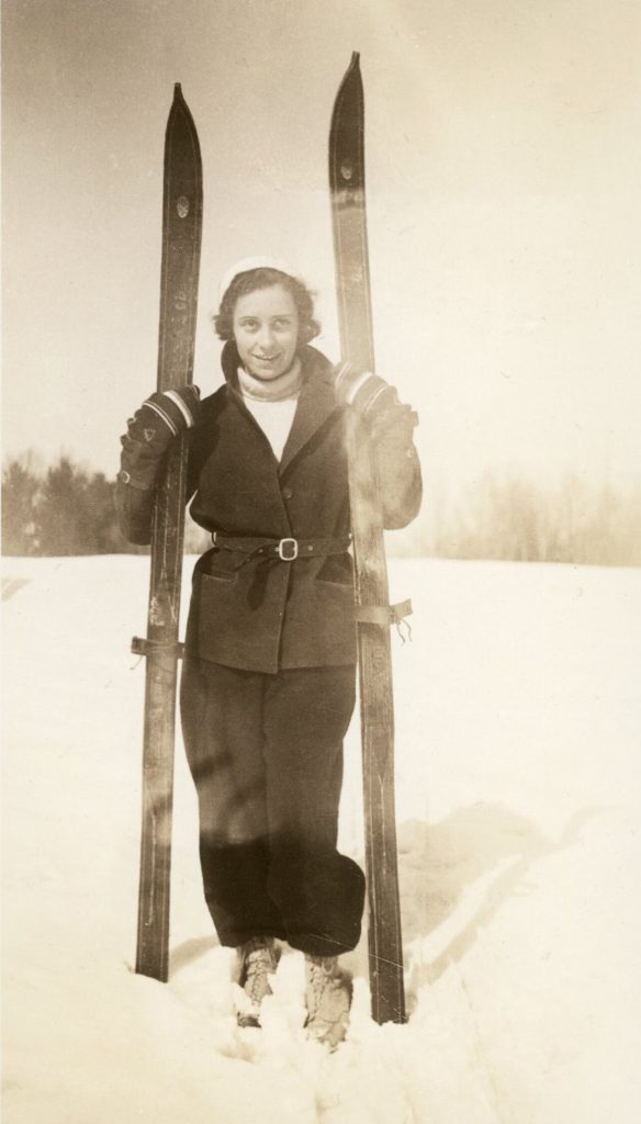 Time to hit the Slopes! 1930s vintage photo of a young woman holding her skiis ready for a day of winter fun. 1930s vintage winter fashion inspiration.