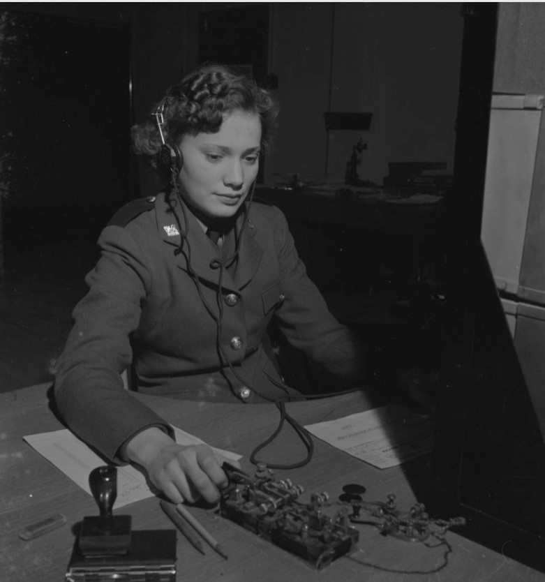 Woman's Air Force, 1940's. Unidentified Woman in uniform using wireless equipment.