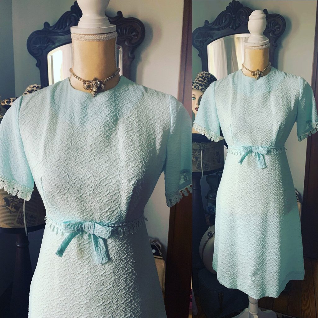 1960s Fashion: 1960s Vicky Vaughn Mini Dress in a pretty light blue with a cute bow at the waist and lace on the cuffs and waistline. 