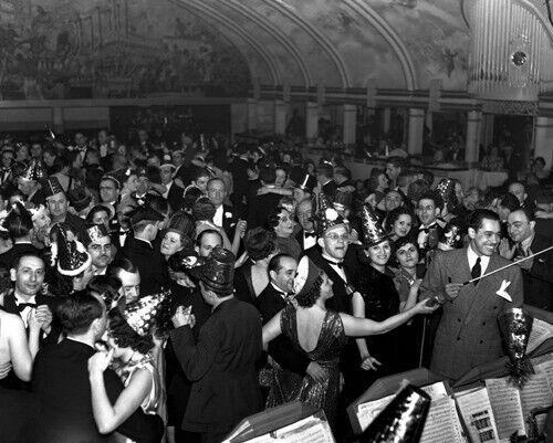 1930s vintage photo of people dancing at the Cotton Club at New Years Eve 1935 wearing 1930s fashions and NYE Party Hats