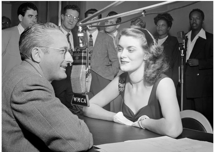 1940s Vintage Photo of big band singer, Beryl Davis with Tommy Dorsey during a radio stint in 1947.