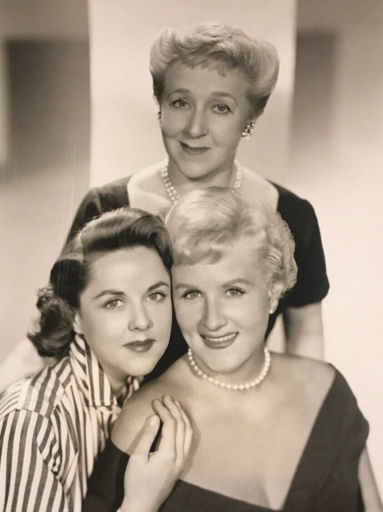 1950s vintage photo of the stars of the TV show "Those Whiting Girls" featuring Margaret Whiting (right), with her sister Barbara (left) and Mabel Albertson (standing) in 1957