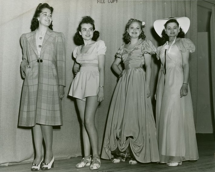 1940s photo of teenage girls modeling early 1940s fashions at the World of Fashion Exhibit at the 1939/1940 New York City World's Fair. 