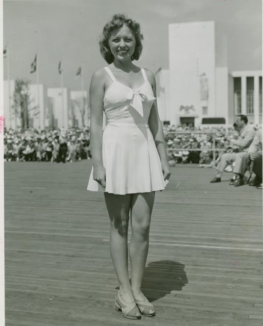 1940s vintage photo of a woman modeling an early 1940s swimsuit at the World of Fashion exhibit at the New York City Worlds Fair 1940